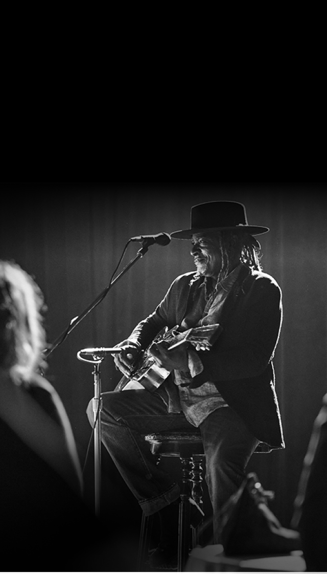 patient performing with a guitar